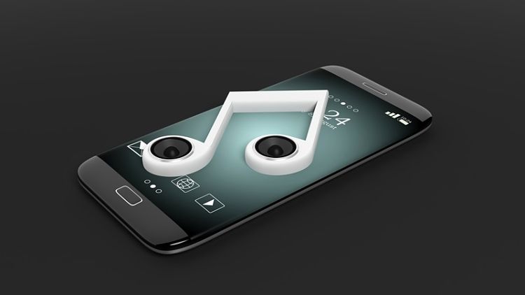 Teléfono móvil con una nota musical en la pantalla: Crea tonos de llamada personalizados