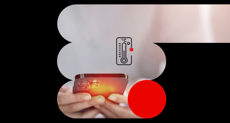 Teléfono móvil sobrecalentado con tono rojo intenso sostenido entre las manos de una persona, simbolizando el calentamiento del dispositivo.